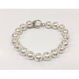 A silver freshwater pearl bracelet set with CZ's.