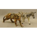 Two porcelain animals. A leopard and a zebra