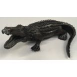 A carved ornate Indian wood crocodile.