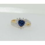 9ct gold Ladies heart set centre stone surrounded by diamonds size M
