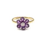 A silver and gold plated Amethyst flower head ring.