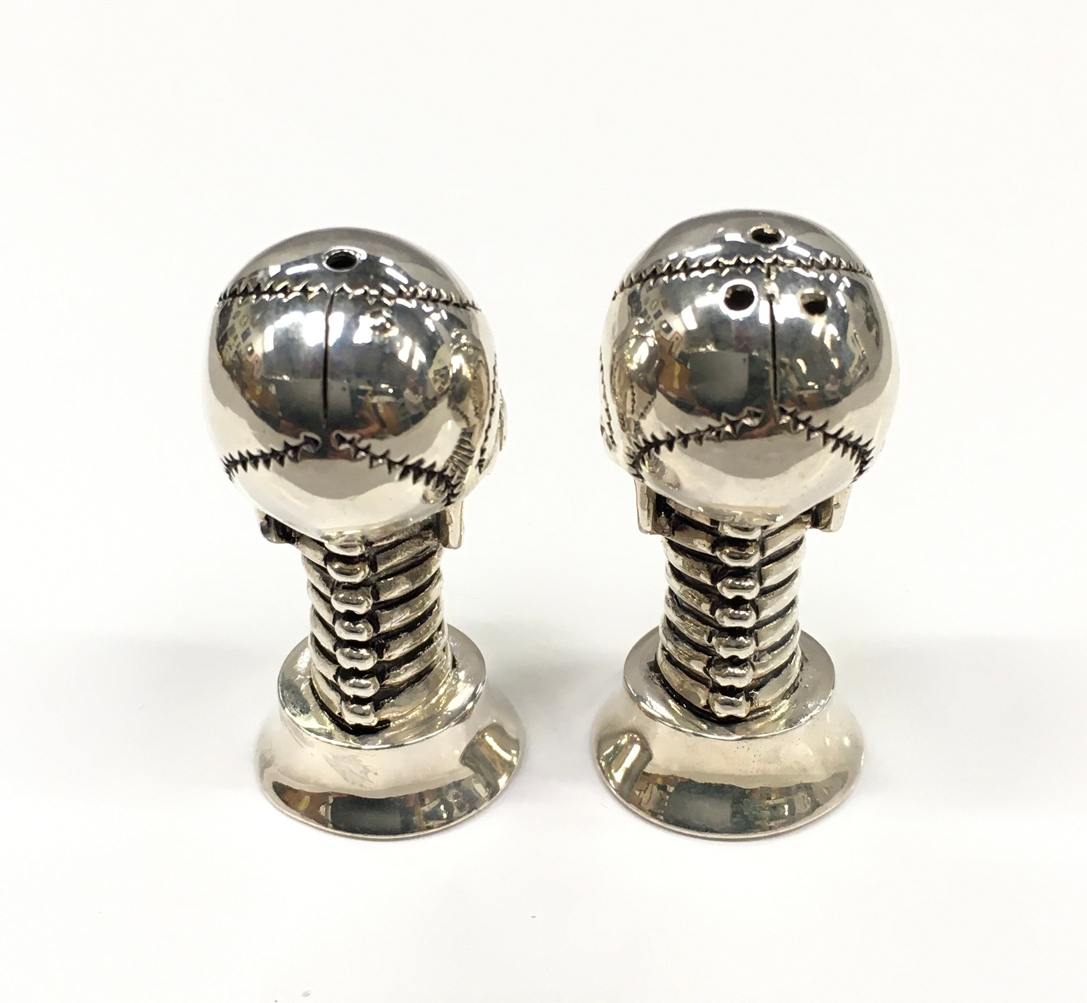 An unusual pair of silver plated scull shaped condiments with ruby eyes. - Image 3 of 4