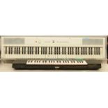 A Yamaha electronic keyboard together with a Gear4Music electronic keyboard (2).