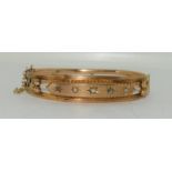 Antique tests as 9ct gold five stone diamond bangle