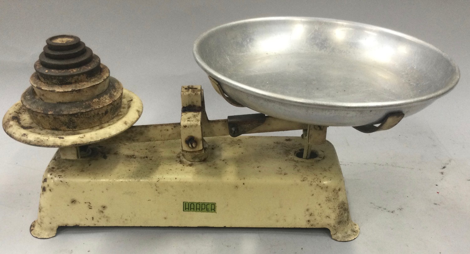 A set of vintage "Harper" kitchen weighing scales with weights.