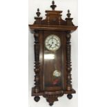 Mahogany chiming wall clock with key and pendulum