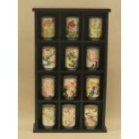 Wall display of oriental tea cups/tumblers