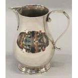 A solid silver sparrow beak cream jug, London hallmark by Vander (176gms)