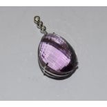 A Very large 60 carat plus natural amethyst and diamond tested as 18ct white gold pendant 58mm x