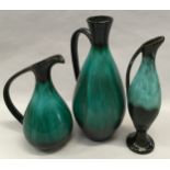 Set of three Blue Mountain graduated studio pottery jugs in green glazes.
