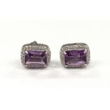 A pair of substantial silver CZ amd Amethyst earrings.