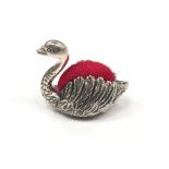 A silver swan pin Cushion.