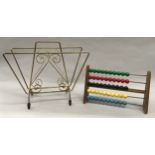 Vintage 1950s brass magazine rack together with a vintage abacus.