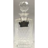 Edinburgh crystal glass decanter with silver neck label.