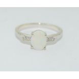 A silver 925 CZ and opal ring, Size N 1/2.