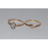 Two 14ct yellow gold interlocking diamond rings, Size M.