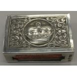 A solid silver matchbox holder, continental hallmarks, with crown motif to top.