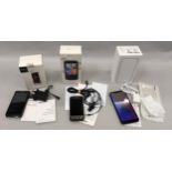 HTC Desire boxed smartphone together with Sony Xperia L boxed smartphone and an unbranded boxed