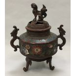 Oriental cloisonne incense burner with enamel decoration and dragon handles set on three legs