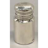 A solid silver scent bottle with original stopper, with engraving to top by Martin Bros.