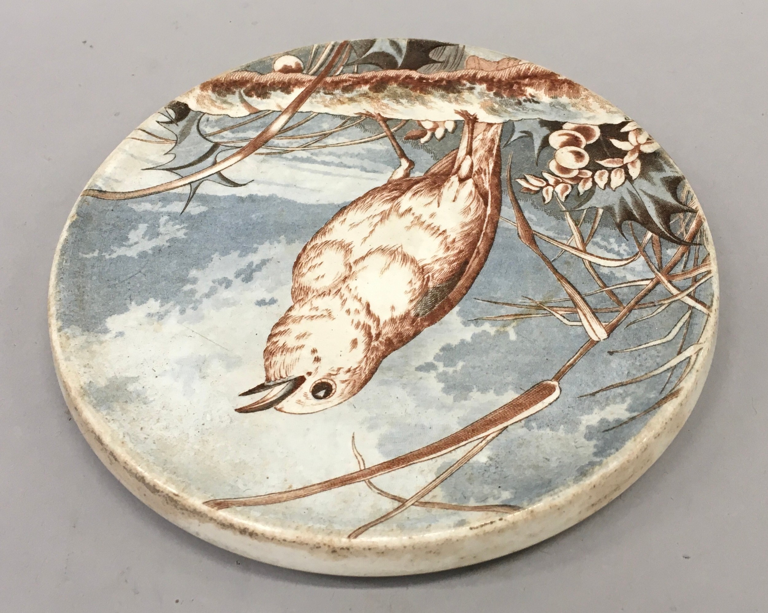 W.T.Copeland and sons circular trivet depicting a bird C1880 15cm diameter - Image 2 of 3