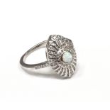A silver and opal paneled Art Deco style ring.