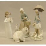 Quanity of LLadro figures together with a Russian Bear