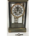 French striking 4 glass clock in brass case with open escapement 30cm tall
