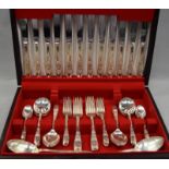 Cooper Bros. & Sons stainless steel complete cutlery set for six with two serving spoons in wooden