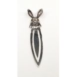 A silver bookmark with rabbit finial.