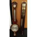 Antique mahogany banjo barometer together with a modern barometer.