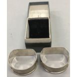 A pair of solid silver napkin rings, 1940's, blank cartouch with Birmingham hall mark.