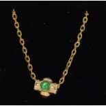 A 14ct yellow gold revolving pendant necklace set with ruby, emerald and sapphire.