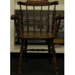 Reproduction oak stick back carver chair.