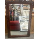 Modern dark wooden framed bevelled edged mirror 121x80cm.