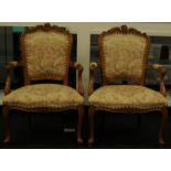 A pair of walnut carver chairs.