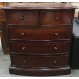 Mahogany bow fronted bedroom chest of two over three drawers with wooden handles 102x91x51cm.