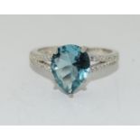 A silver 925 ring with pear shaped aquamarine stone to centre, Size P 1/2.