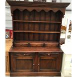 Large dark oak solid dresser with two shelves and three spice drawers to top section and two