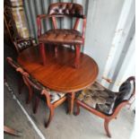 Victorian mahogany wind out extendable dining table on tapered lags together with five matching