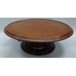 A mahogany lazy susan with rotating circular top 52cm diameter.