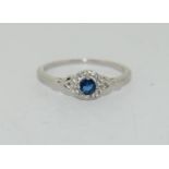 A sterling 925 silver ring with blue stone to centre, Size P 1/2.