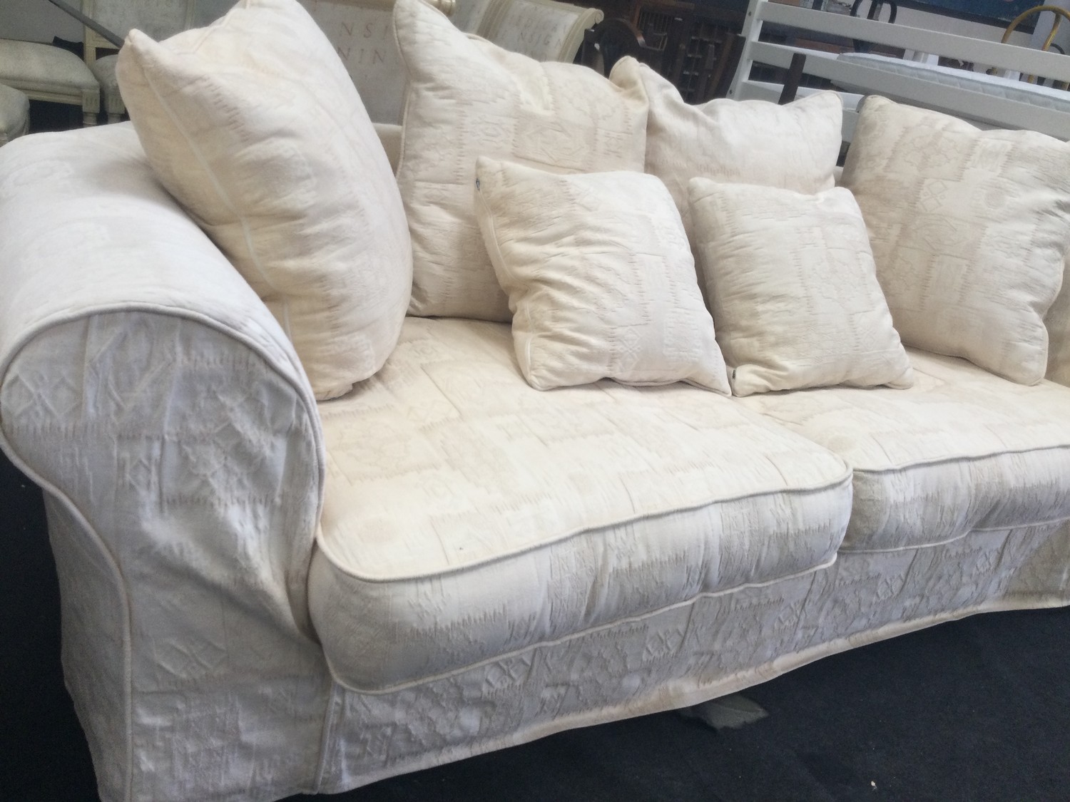 A large three seater settee with hexagonal back upholstered in beige fabric 230x120x70cm. - Image 2 of 3