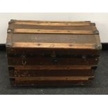 Antique domed top trunk together with a collection of saw?s.