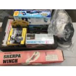 Box of car accessories to include tyre inflater, car washing kit, Sherpa Winch and other items.