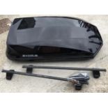 A top box and Thule roof rack with keys and fittings.