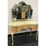 Kidney shaped dressing table with mirror.