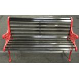 Vintage recently refurbished red painted cast iron two seater garden bench with brown painted