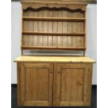 Small pitch pine low kitchen cupboard and a set of pine wall shelves.
