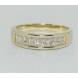 A gold on 925 silver baguette CZ eternity ring Size V.